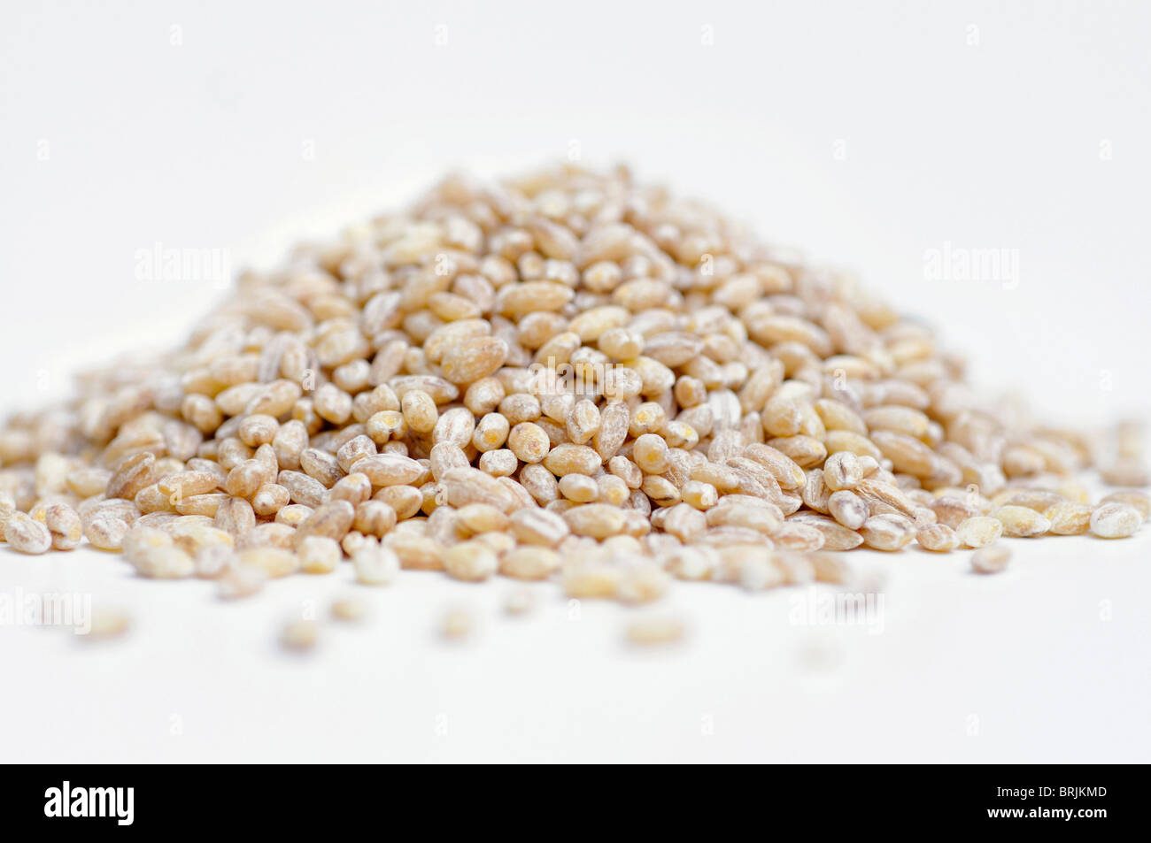 Pile of brown pearl barley on white background Stock Photo