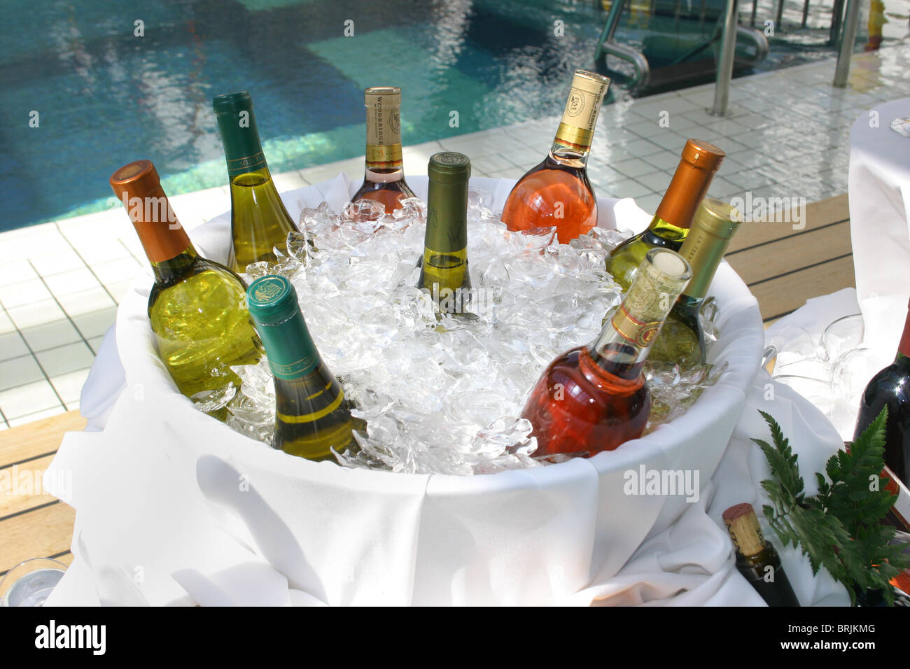 Wine bottles in a wine bucket full of ice, representing a variety of special wines from around the world. Stock Photo