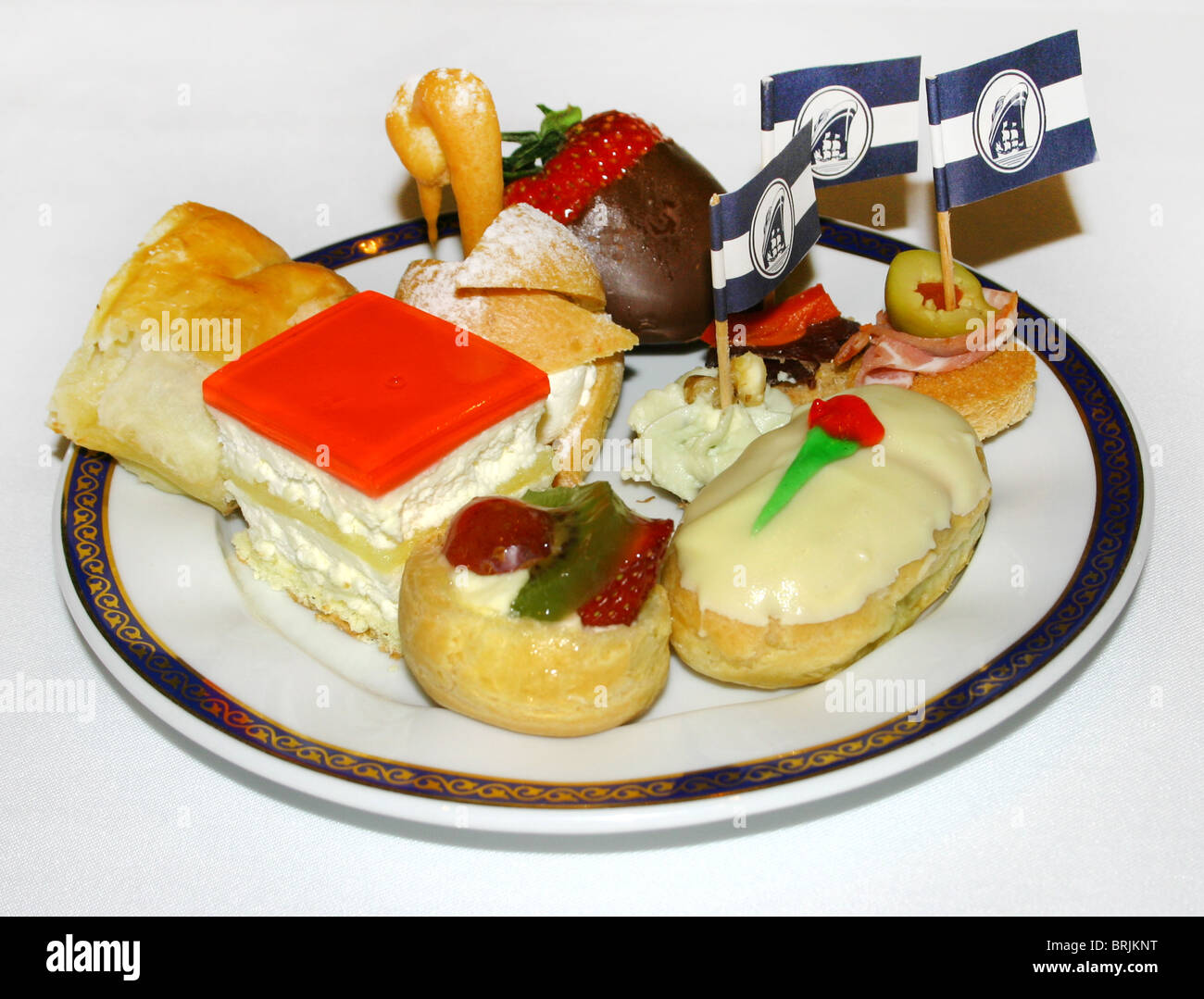 An array of tasty gourmet bite-sized desserts on a plate. Stock Photo