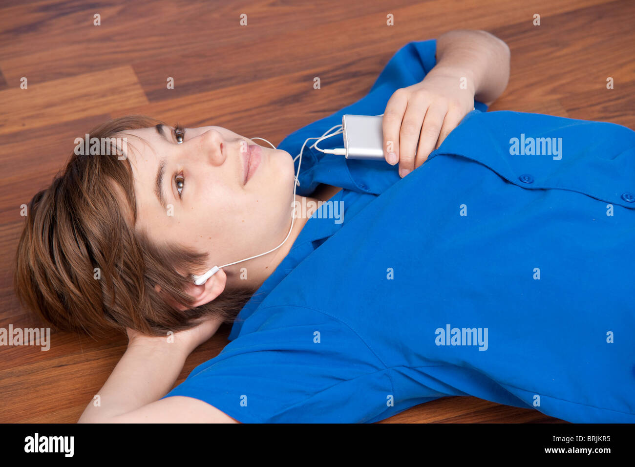 Teenage Boy Listening to MP3 Player Stock Photo