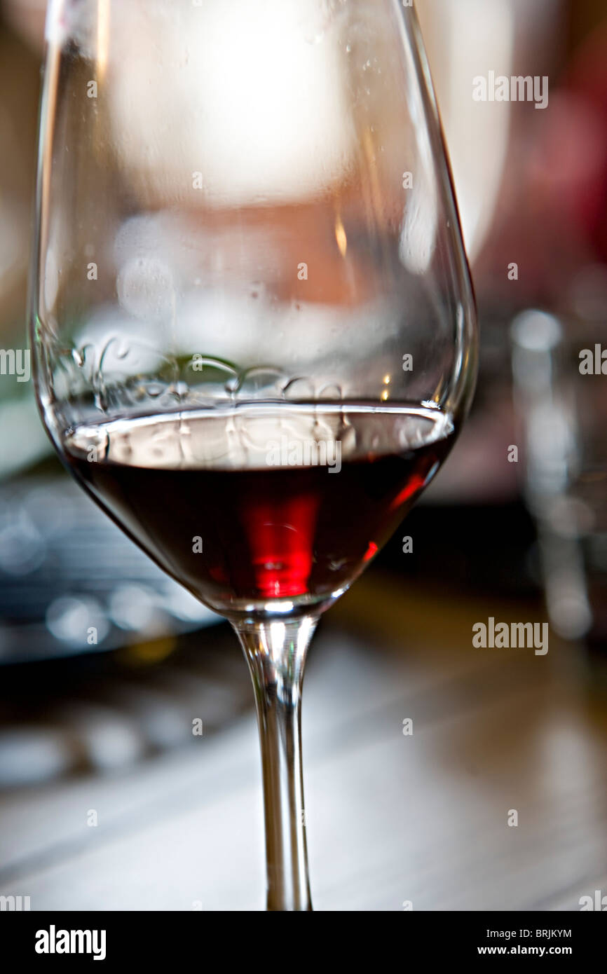 Tears of wine on glass of red wine Stock Photo