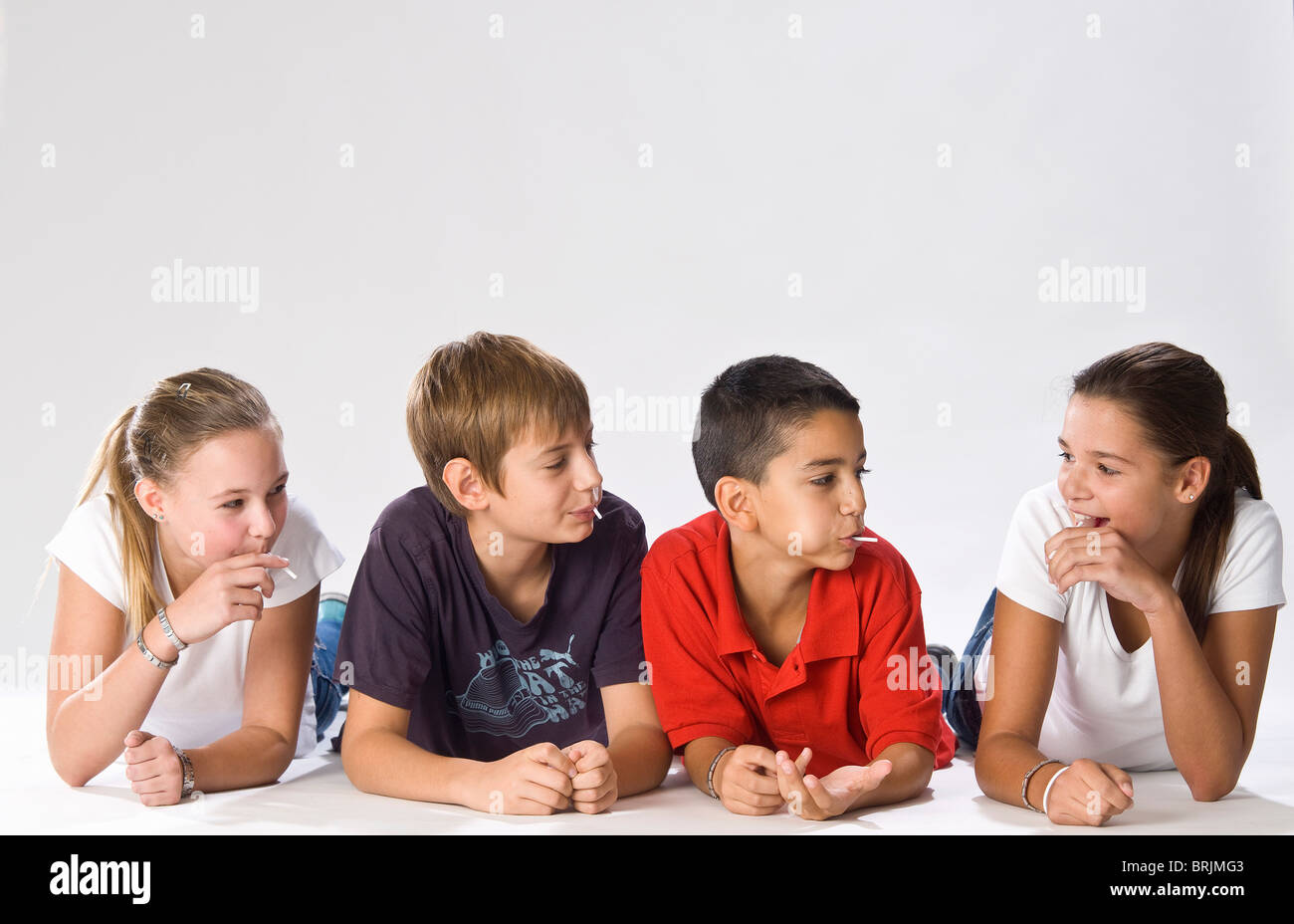 Preteen girl lying on stomach hi-res stock photography and images - Alamy