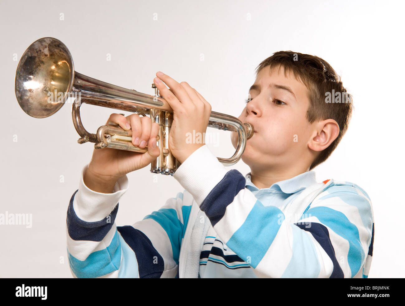 Boy Playing the Trumpet Stock Photo