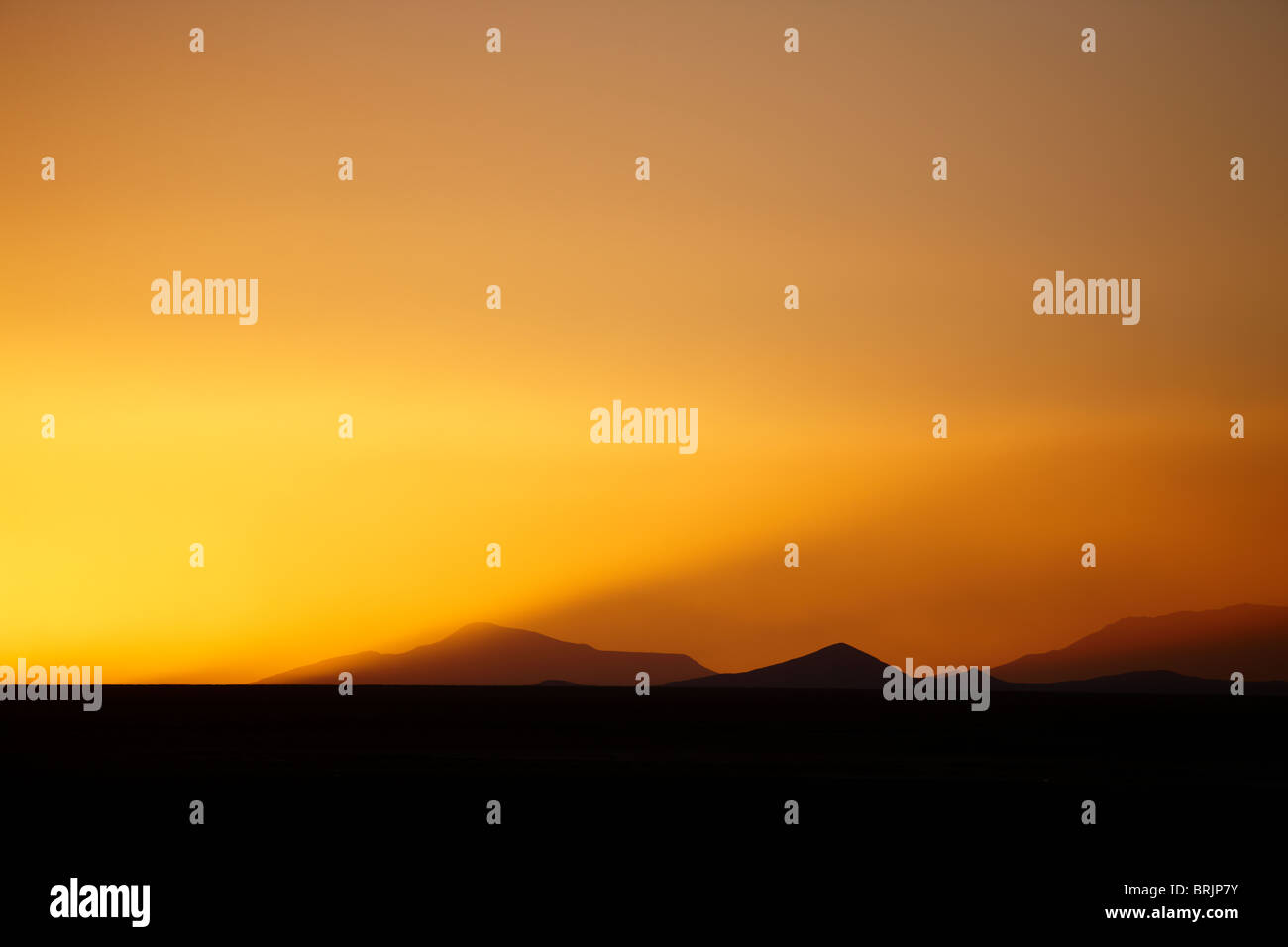 sunset over the Salar de Uyini, Bolivia Stock Photo