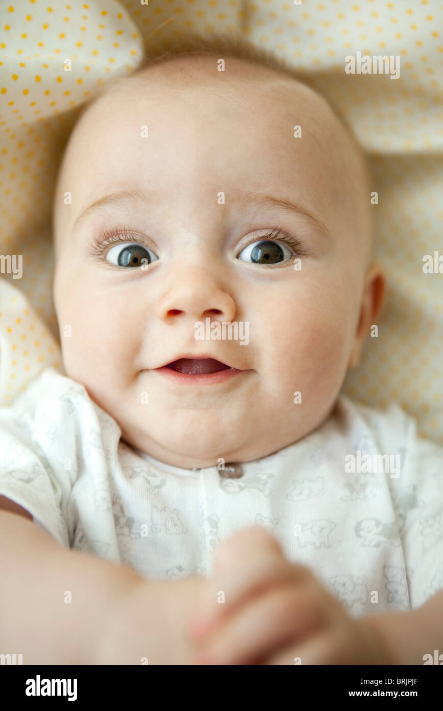 Infant looking at camera with wide eyes, portrait Stock Photo Alamy