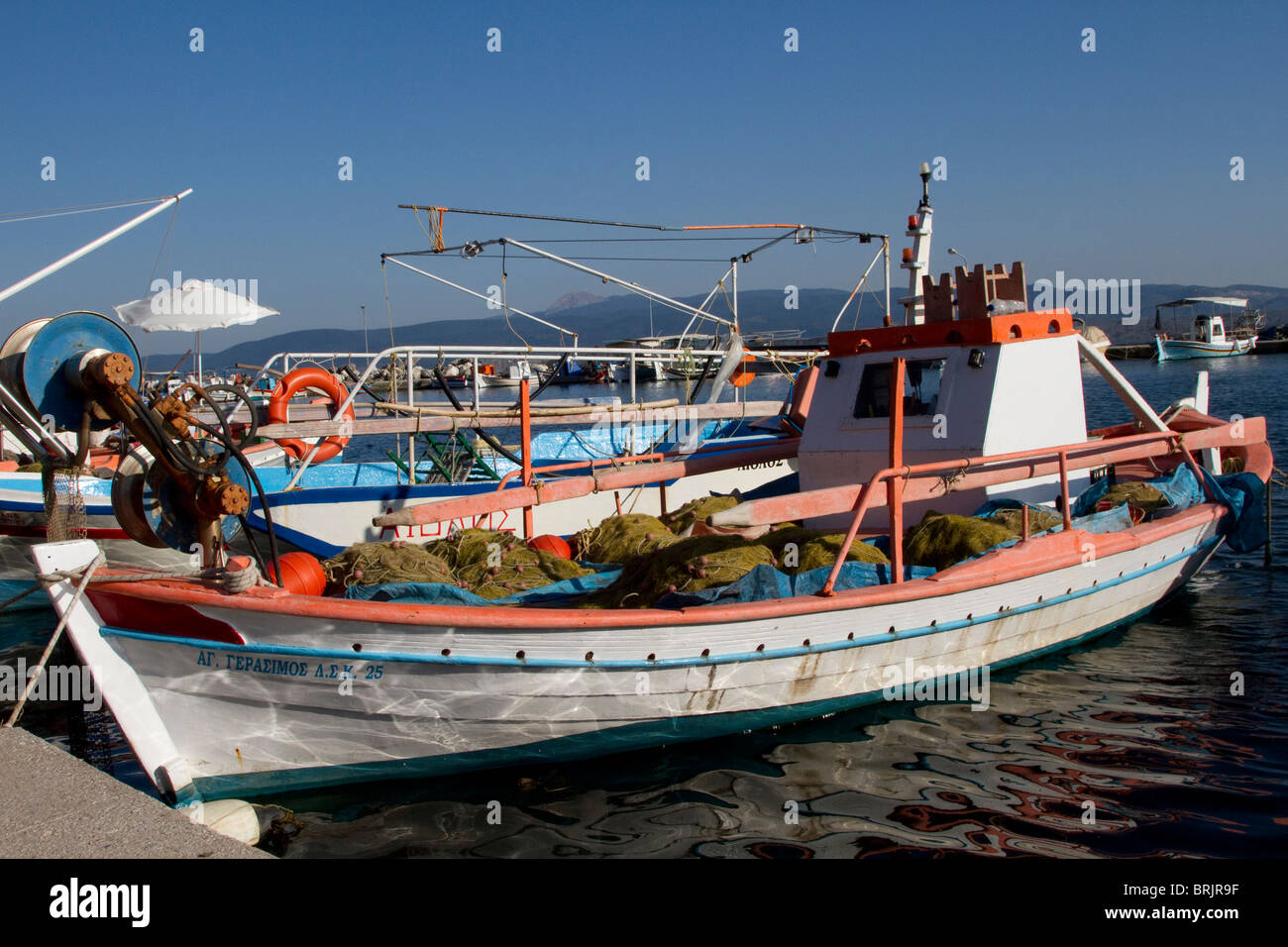 Fishing boat moored to the quay side in Skala Kallonis; Lesvos Stock Photo