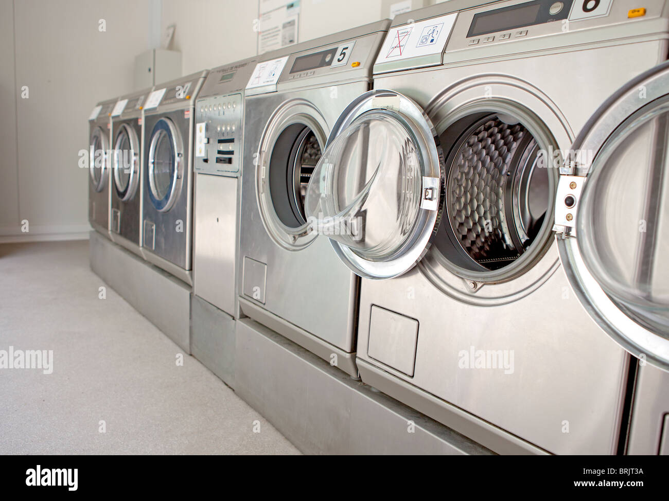 row of washing machines in closeup Stock Photo