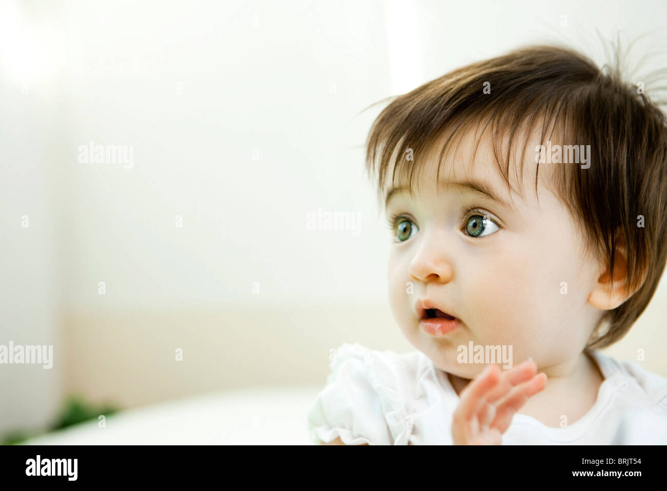 Baby girl with startled expression, portrait Stock Photo