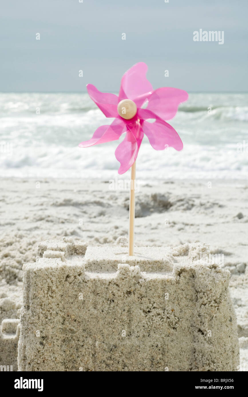 Pinwheel stuck in sand castle Stock Photo