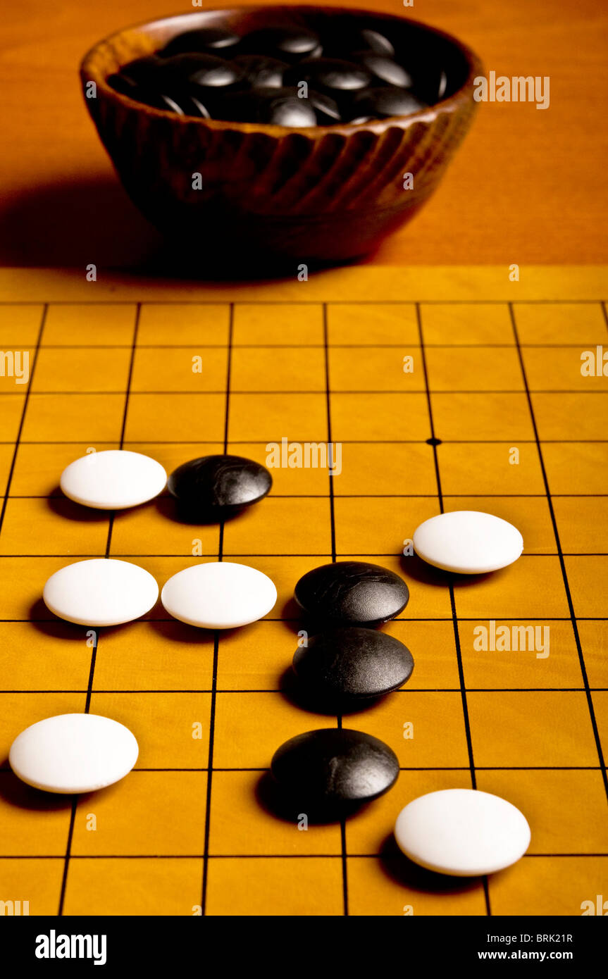 stones on the board during a Go game Stock Photo Alamy