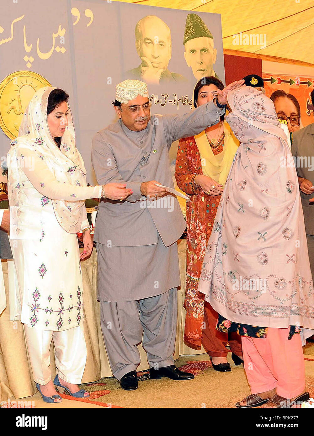 President, Asif Ali Zardari distributes cheques among beneficiaries of Waseela-e Haq Program under Benazir Income Support Stock Photo