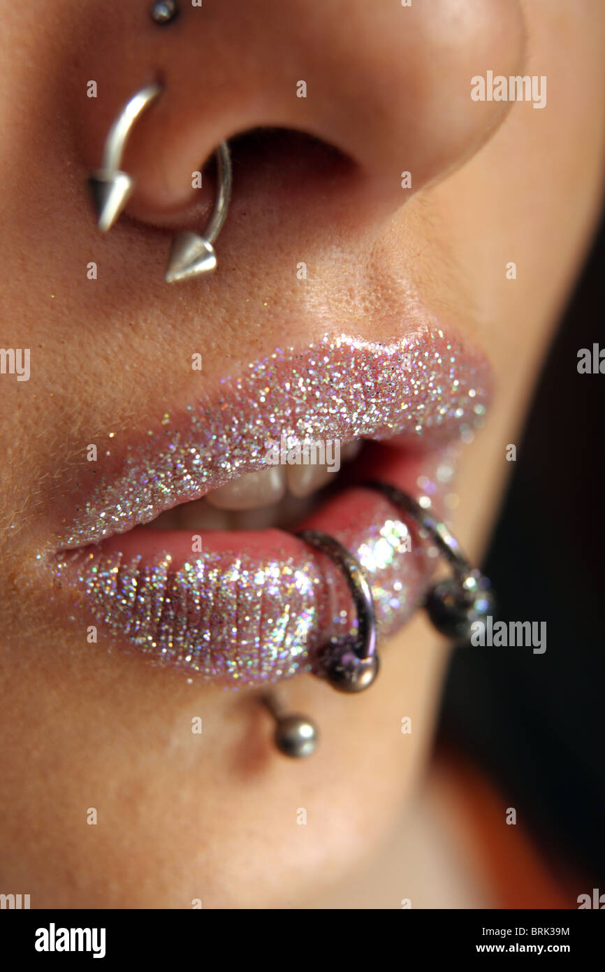 Close up of a girls pierced lips. Stock Photo