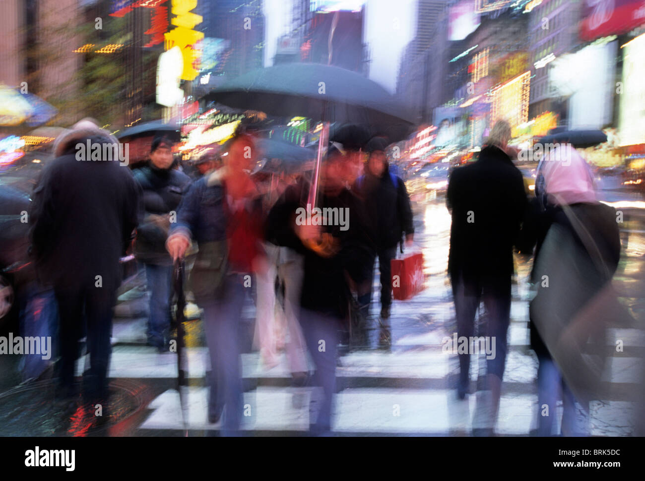 Rainy day in New York City People Crossing the street with umbrellas ...