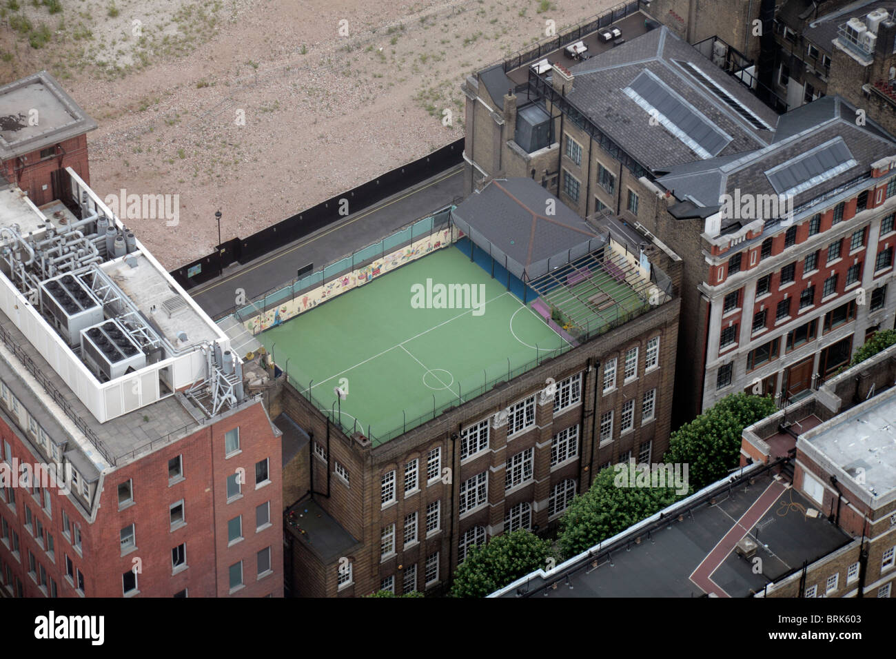 Aerial view of a rooftop primary school playground around packed