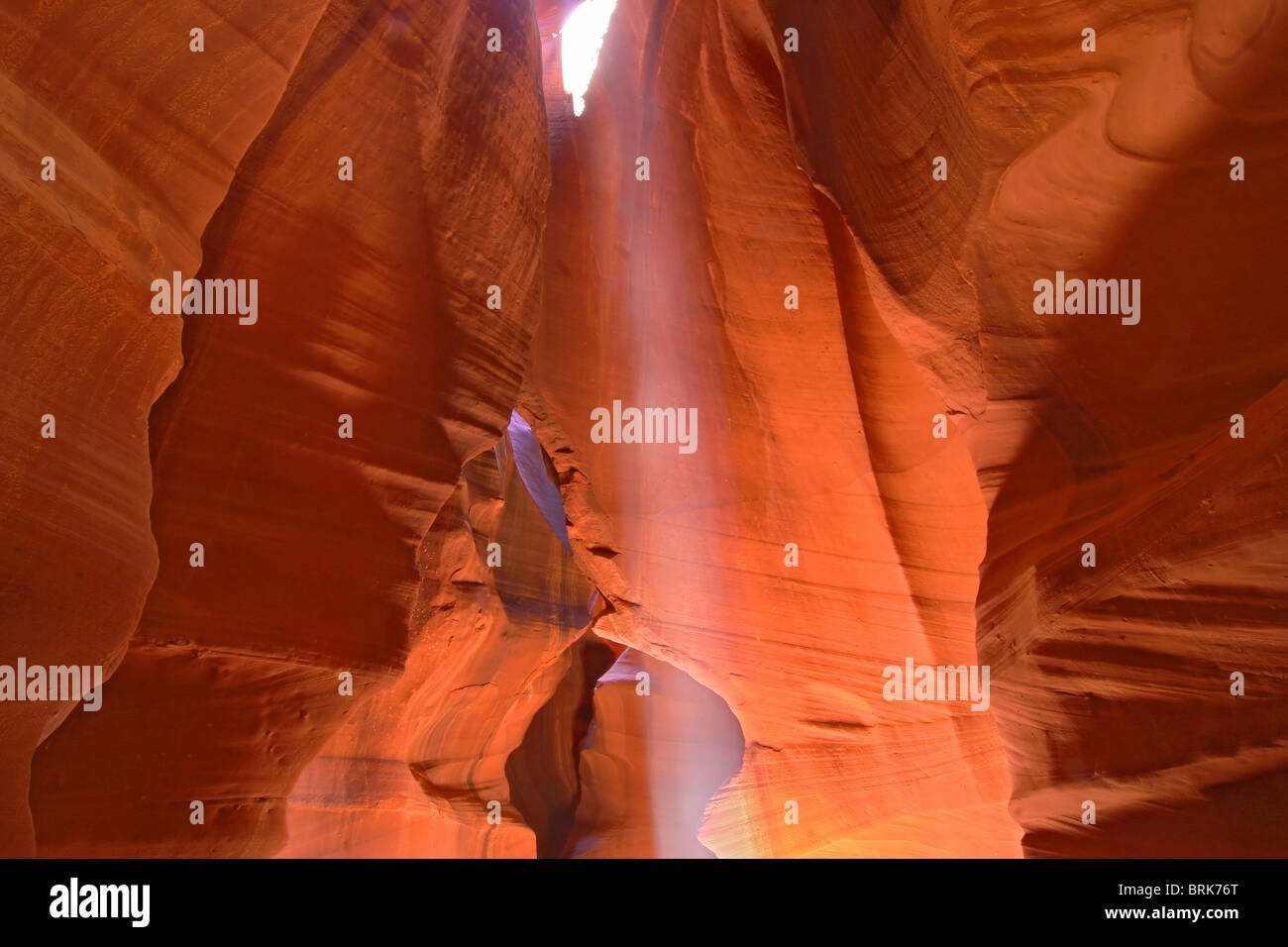 famous Antelope Canyon in Page Arizona with smooth orange walls and a perfect beam of light Stock Photo