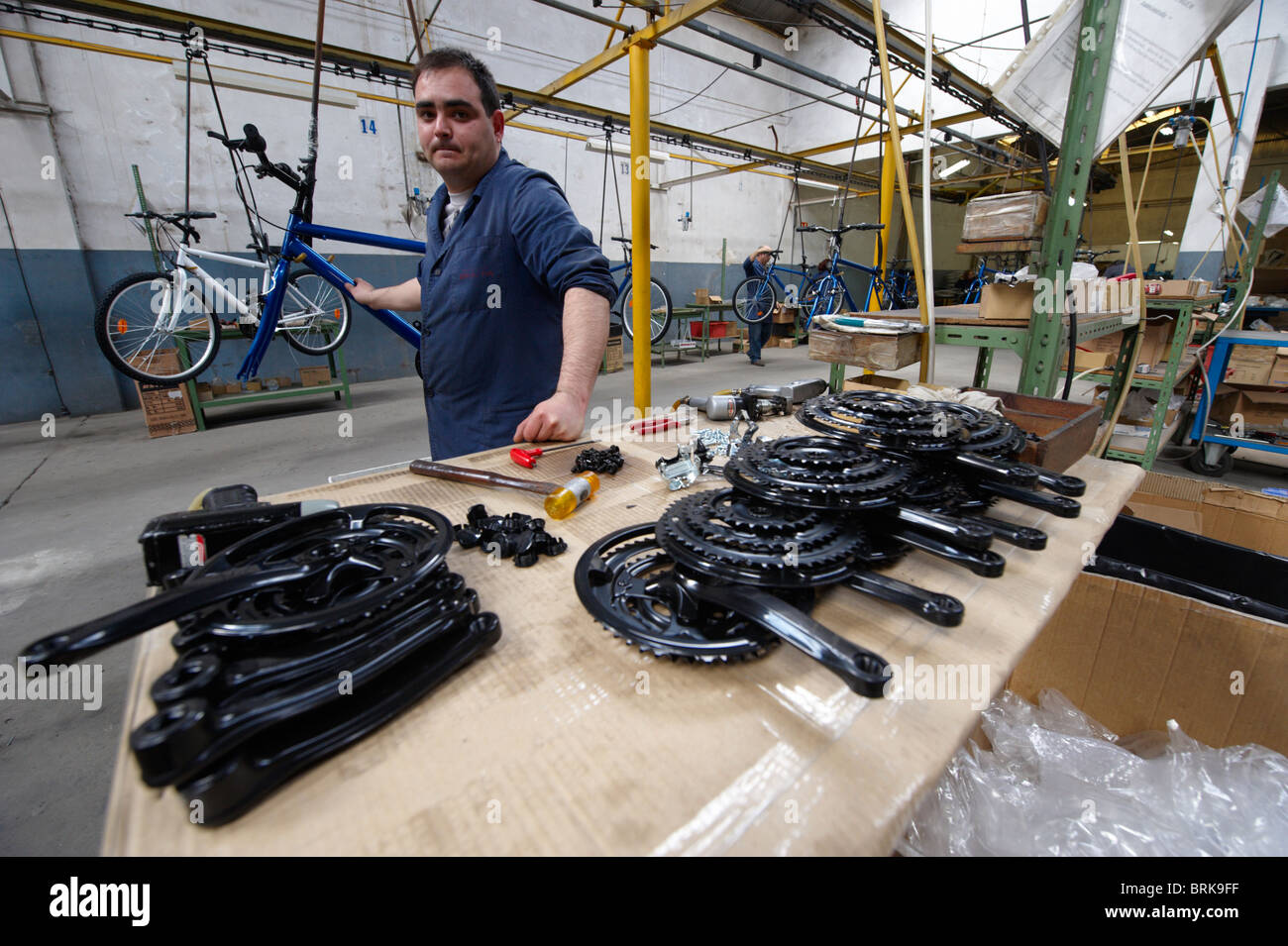 Worker at the assembly line of a bicycle factory Stock Photo Alamy