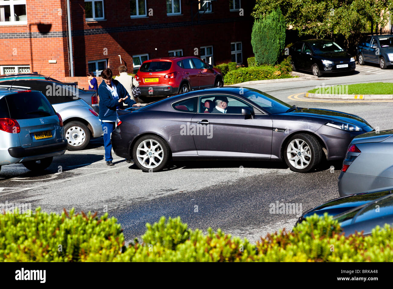 woman backing out car driver Stock Photo Alamy