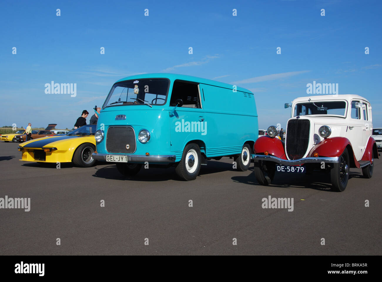 Ford cars from different eras on display, among them a German registered Ford Taunus utility van and a 1930s Ford Popular Stock Photo
