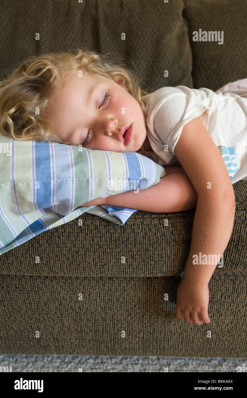 A young girl taking a nap in Oak View, California. Stock Photo