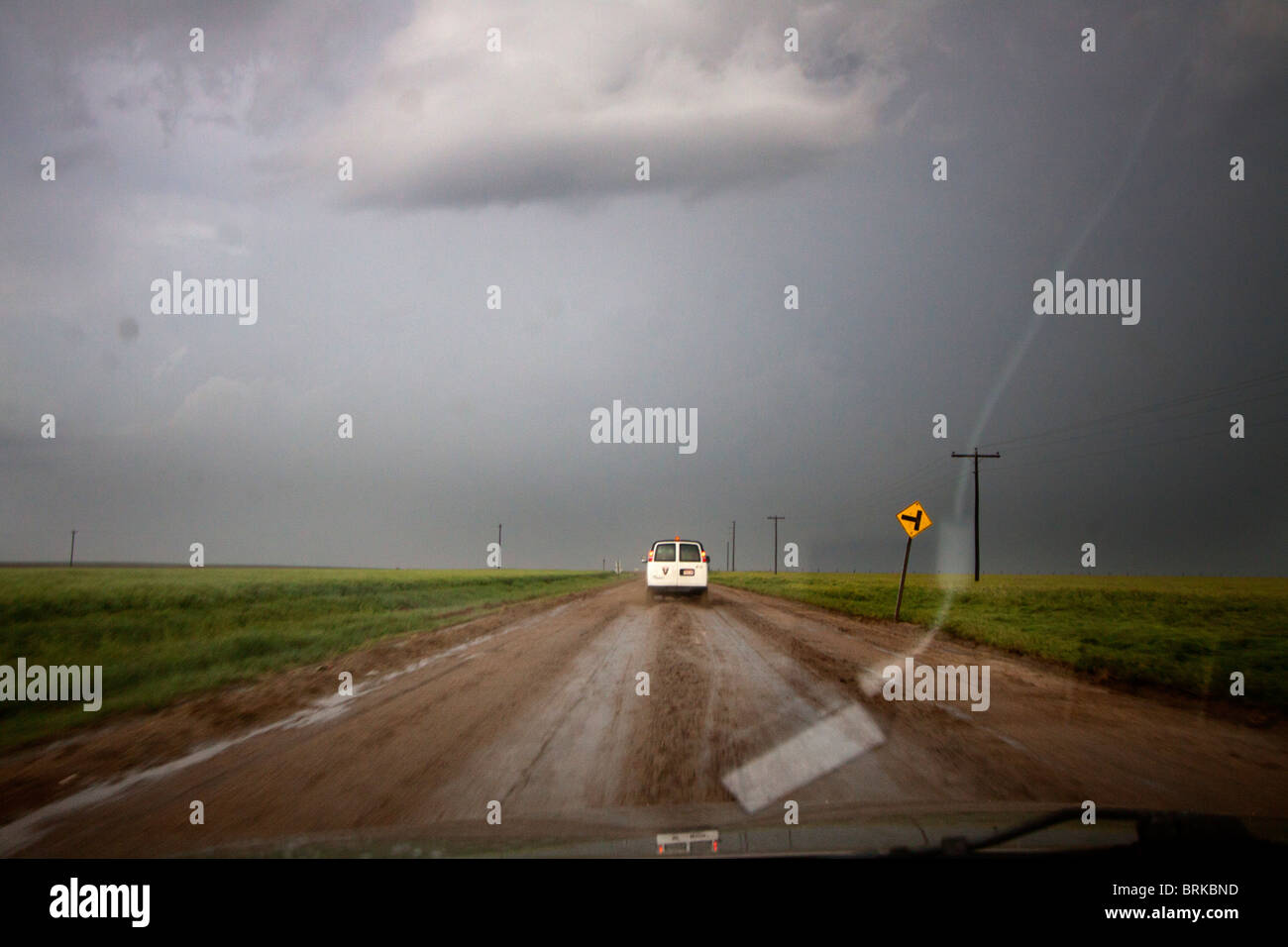 View form the dash of a storm chaser's vehicle as he slogs through deep mud during a thunderstorm in Kansas, May 23, 2010. Stock Photo