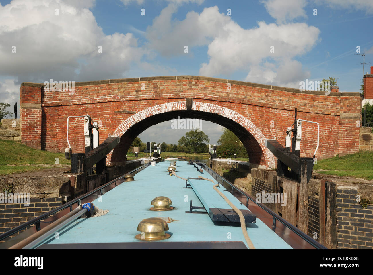 A narrow boat passing under the Redhill Lock Bridge, River Soar