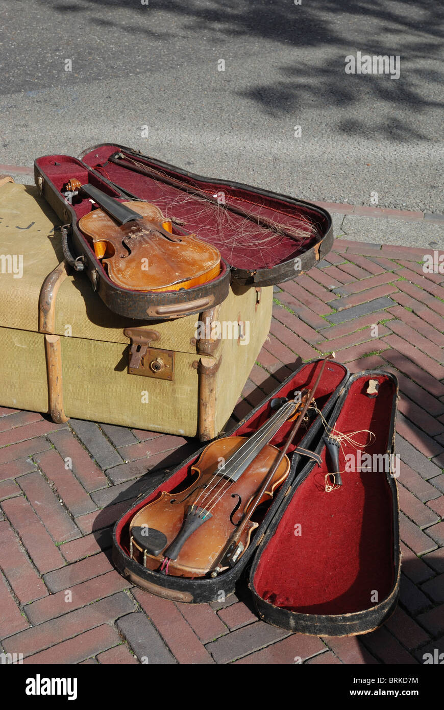 Old violins for sale at a flea market Maastricht, the Netherlands Stock Photo -