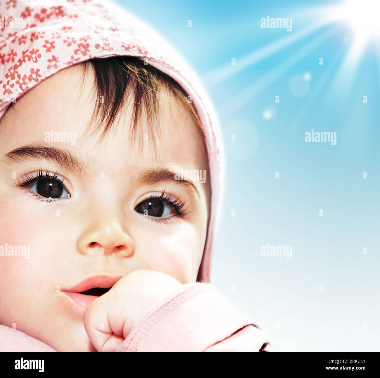 Little girl closeup portrait over blue sky Stock Photo - Alamy