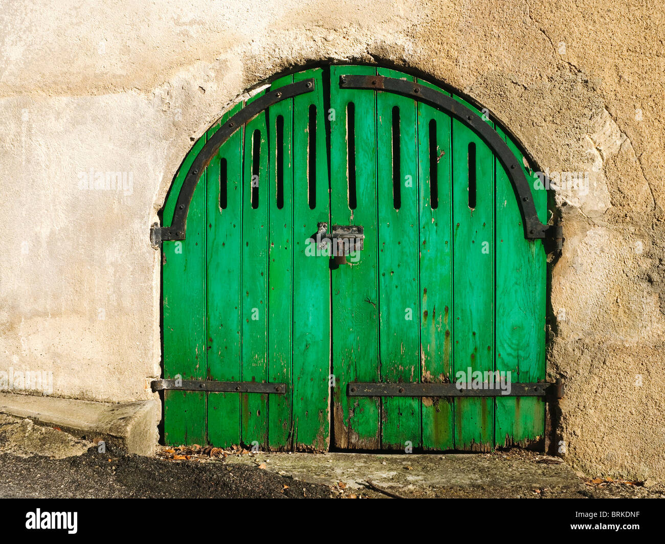 Old locked gates to underground wine cellar - Indre-et-Loire, France. Stock Photo