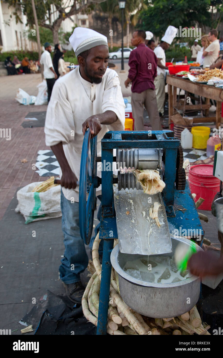 Forodhani Gardens, Stone Town, Zanzibar. Squeezing Sugar Cane to Make