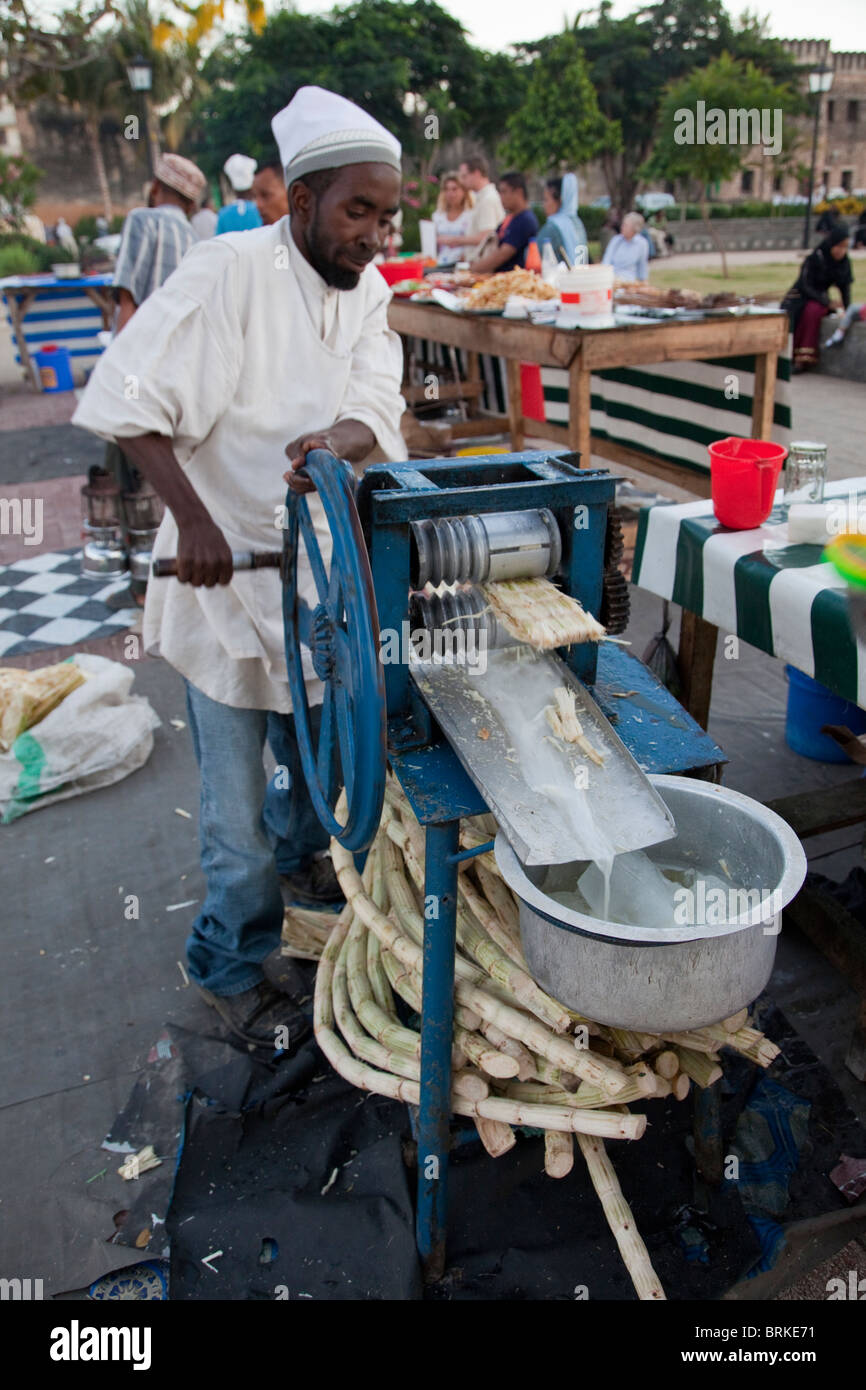 Forodhani Gardens, Stone Town, Zanzibar. Squeezing Sugar Cane to Make