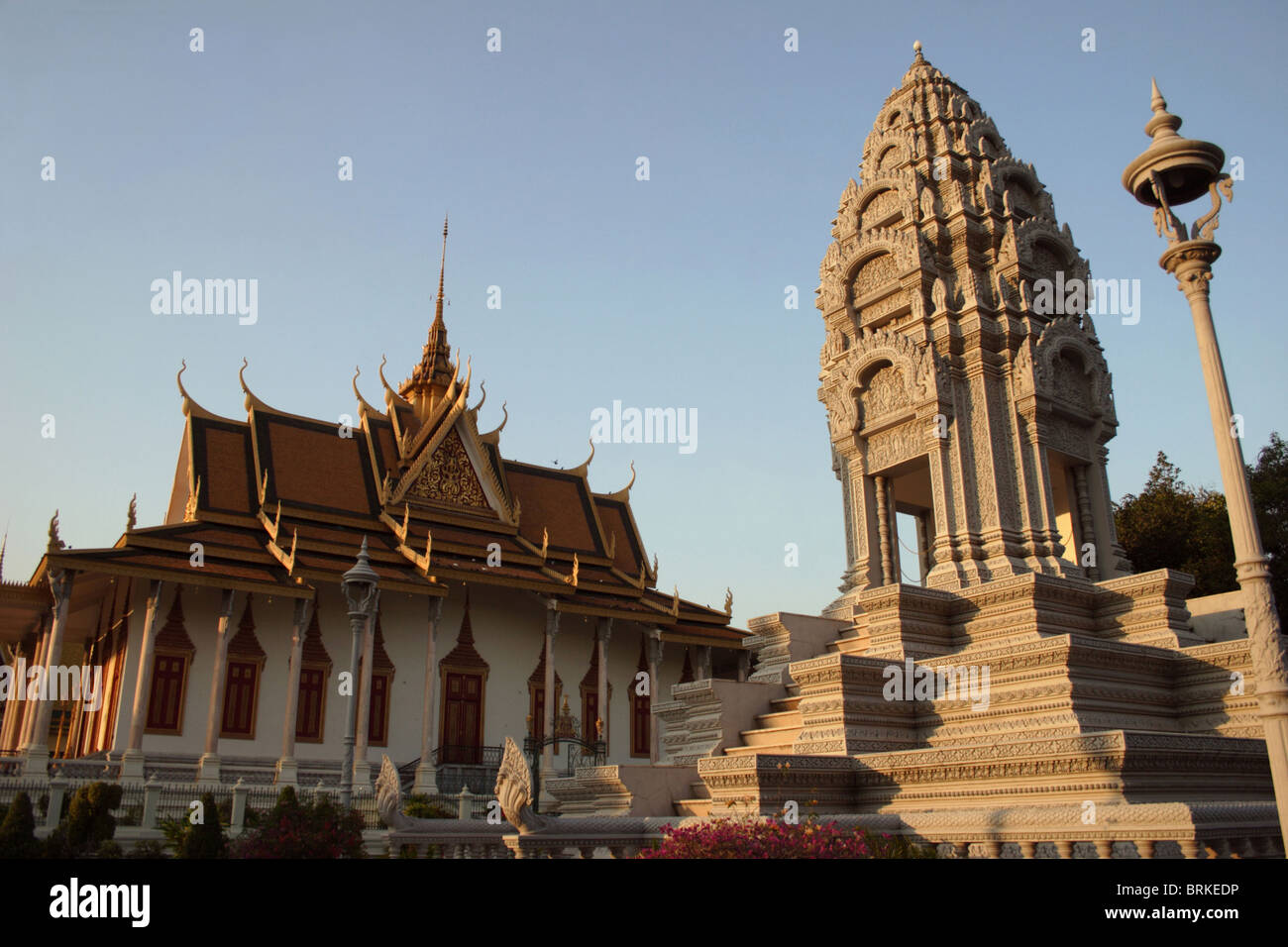 An ancient Buddhist stupa is illuminated by late afternoon sun at The Royal Palace Museum complex in Phnom Penh, Cambodia. Stock Photo