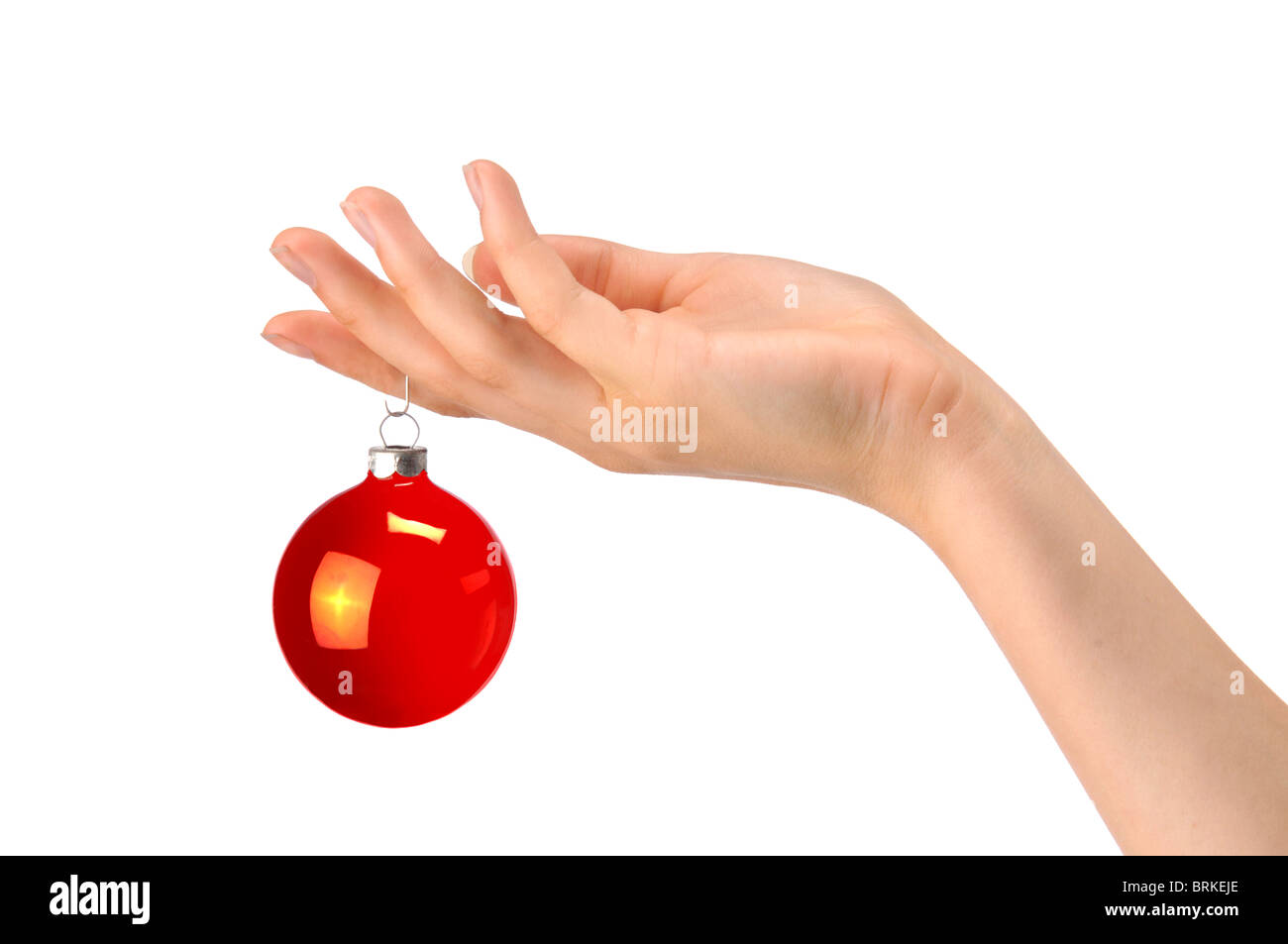 hand holding red christman ornament Stock Photo