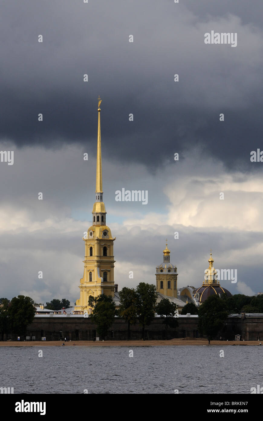 The golden spire and dome of Peter and Paul Cathedral viewed across the Neva River on a stormy afternoon. St Petersburg, Russia. Stock Photo