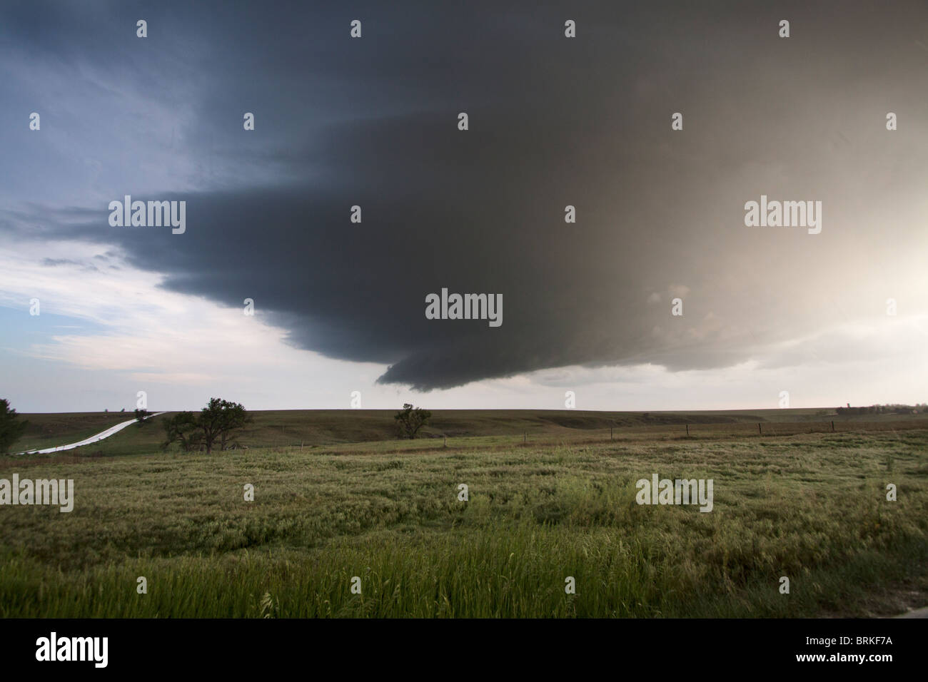 A supercellular thunderstorm with a wall cloud and a hint of a funnel cloud in Kansas, May 23, 2010. Stock Photo