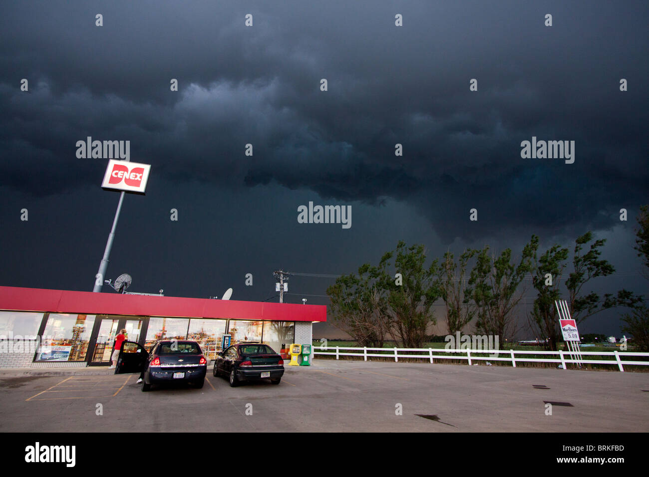 A squall line descends on a Cenex station in rural Nebraska, USA. Stock Photo