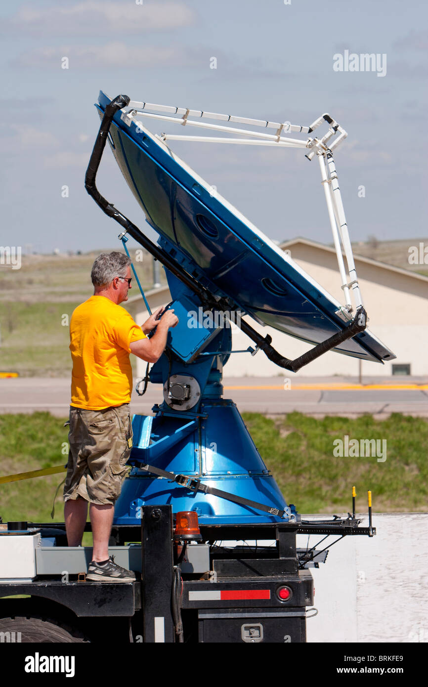 Storm chaser and Project Vortex 2 member Herb Stein repairs the Doppler on Wheels radar dish in Kimball, Nebraska, USA Stock Photo