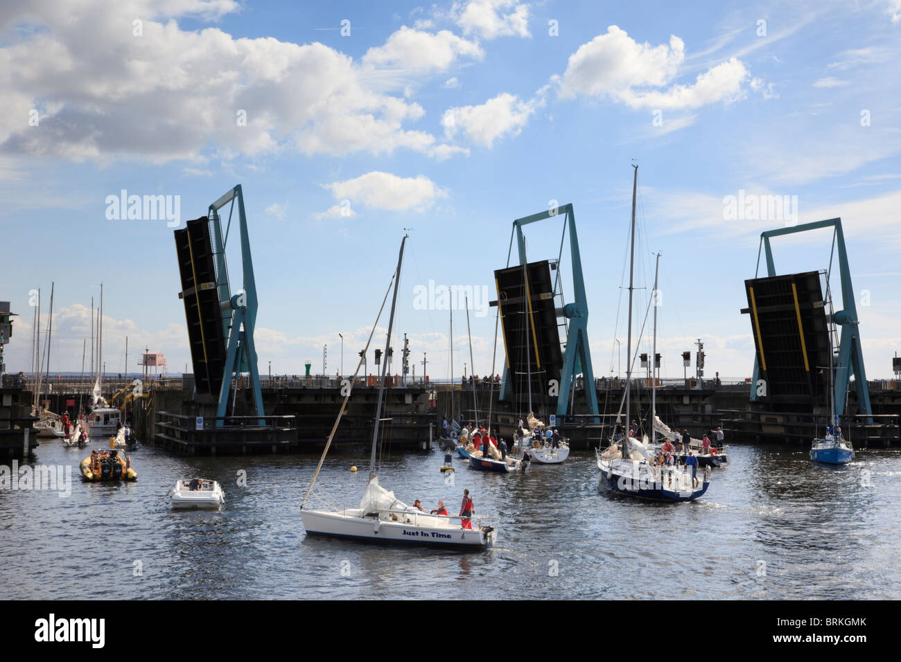 Cardiff Bay, South Wales, UK. Cardiff Barrage bascule bridges open to let boats into navigation locks from bay on landward side. Stock Photo