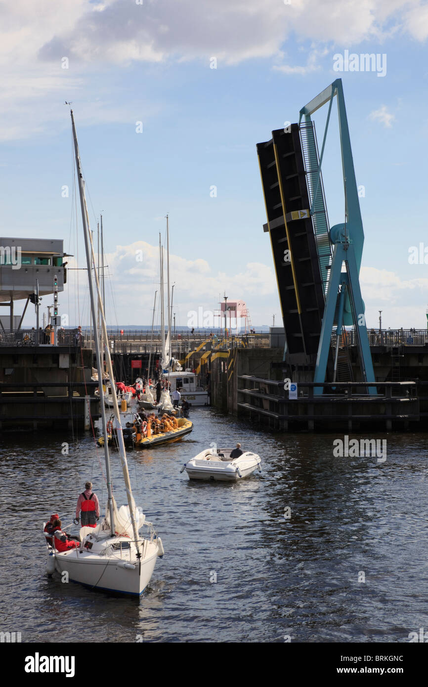 Cardiff Bay, South Wales, UK. Cardiff Barrage bascule bridge open to let boats into navigation locks from bay on landward side. Stock Photo