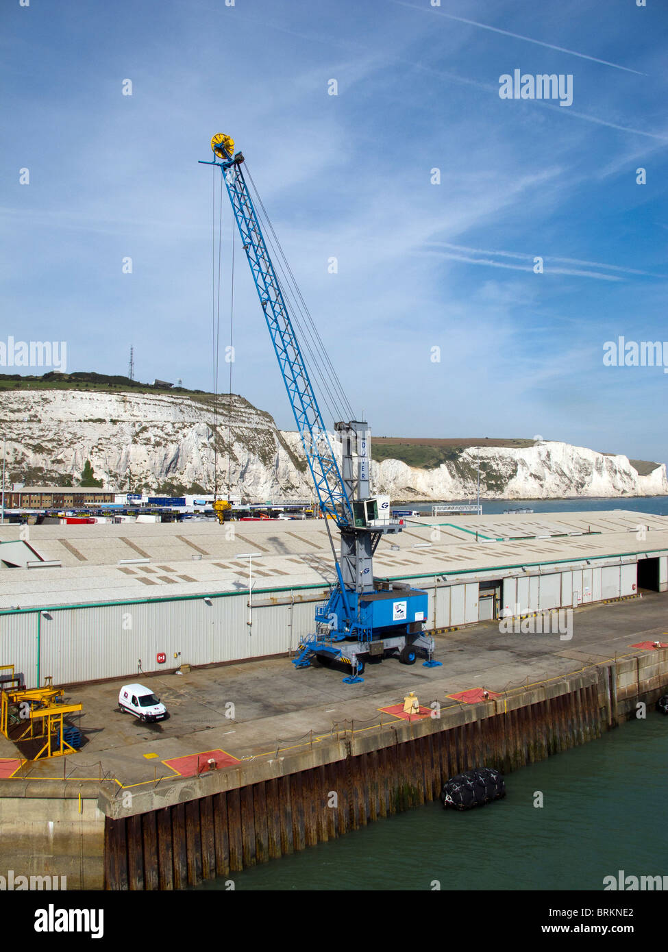 A blue cargo crane sitting on the dockside of the Port of Dover Stock Photo