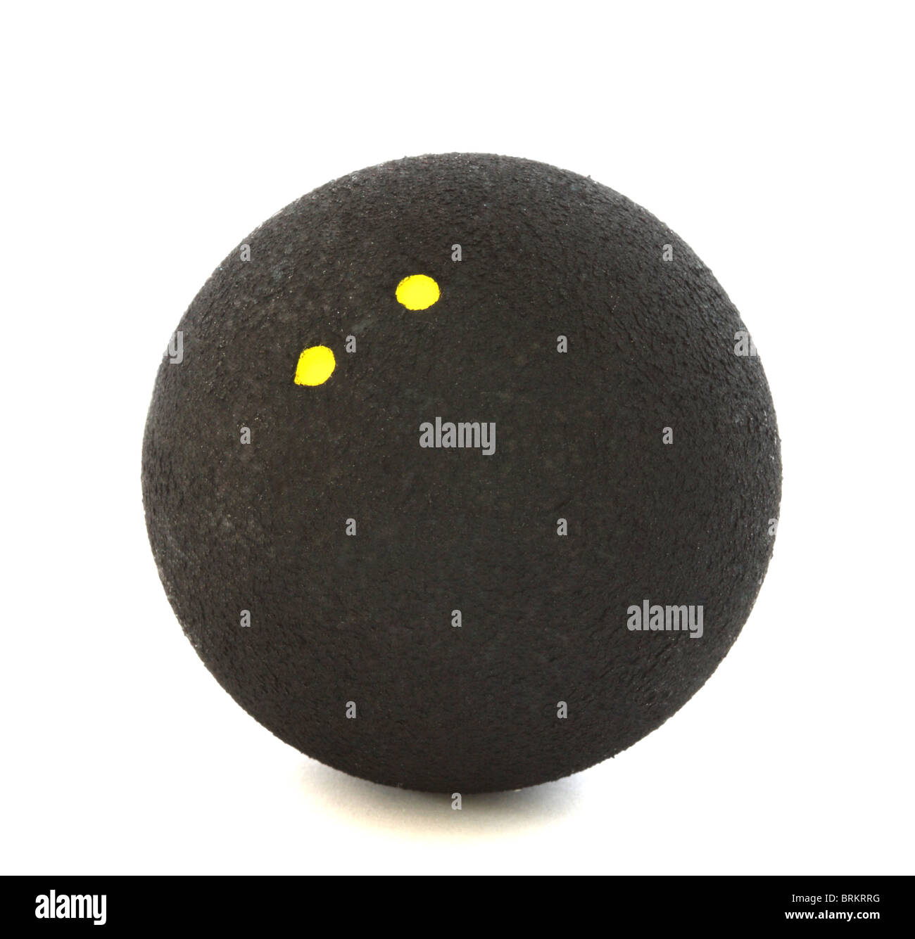 Squash ball with two yellow dots on white background Stock Photo Alamy