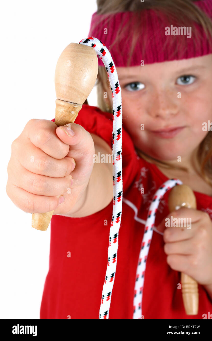 Small girl handing you her jump rope isolated on white Stock Photo - Alamy