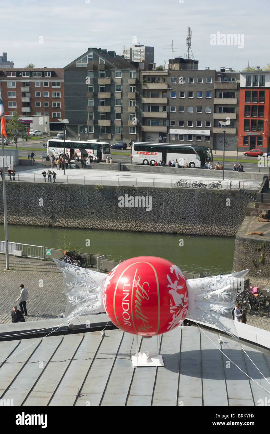 Cologne - the Lindt Chocolate museum and working factory tour on the old quay island - tours arrive Stock Photo