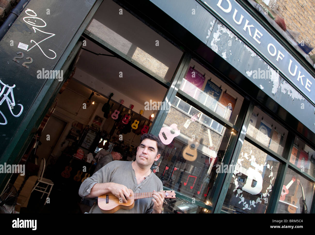 Matthew Reynolds of the Duke of Uke ukulele shop in Hanbury Street, Brick  Lane, London Stock Photo - Alamy