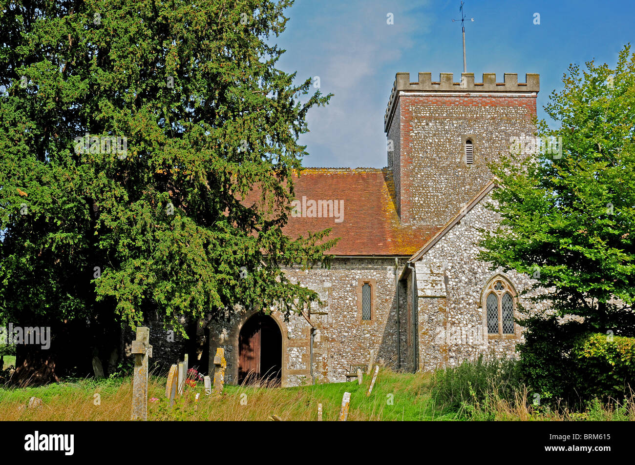 All Saints twelfth and thirteenth century flint church East Dean, West Sussex. September Stock Photo