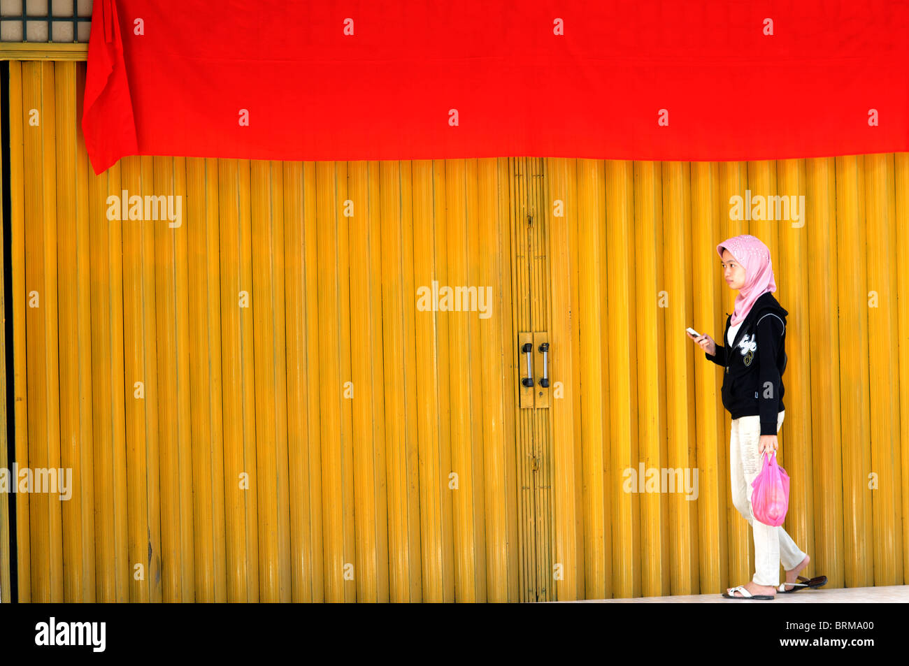 woman with cellphone, batu pulau kundur riau woman phone indonesia Stock Photo