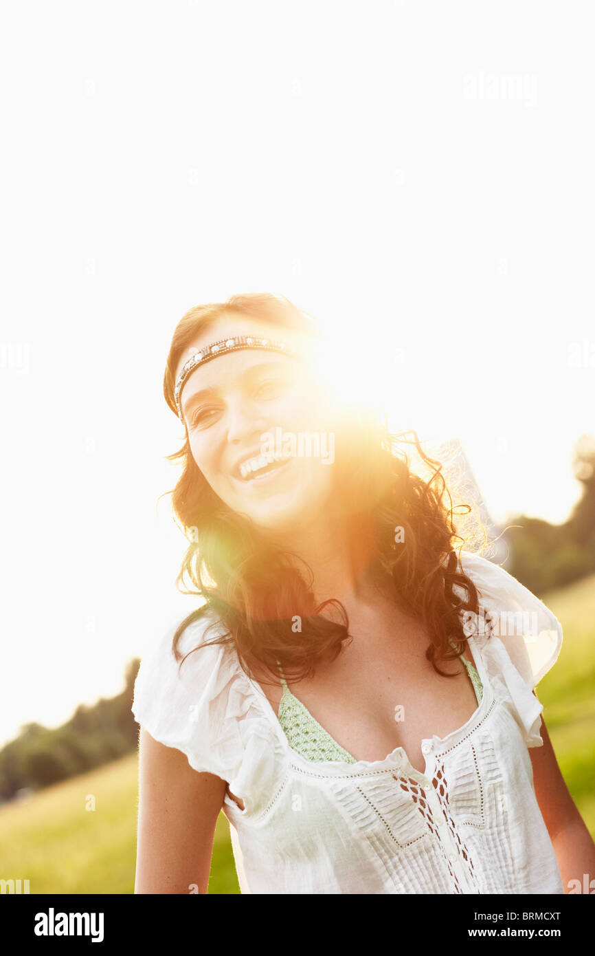 Young woman by sunset Stock Photo - Alamy