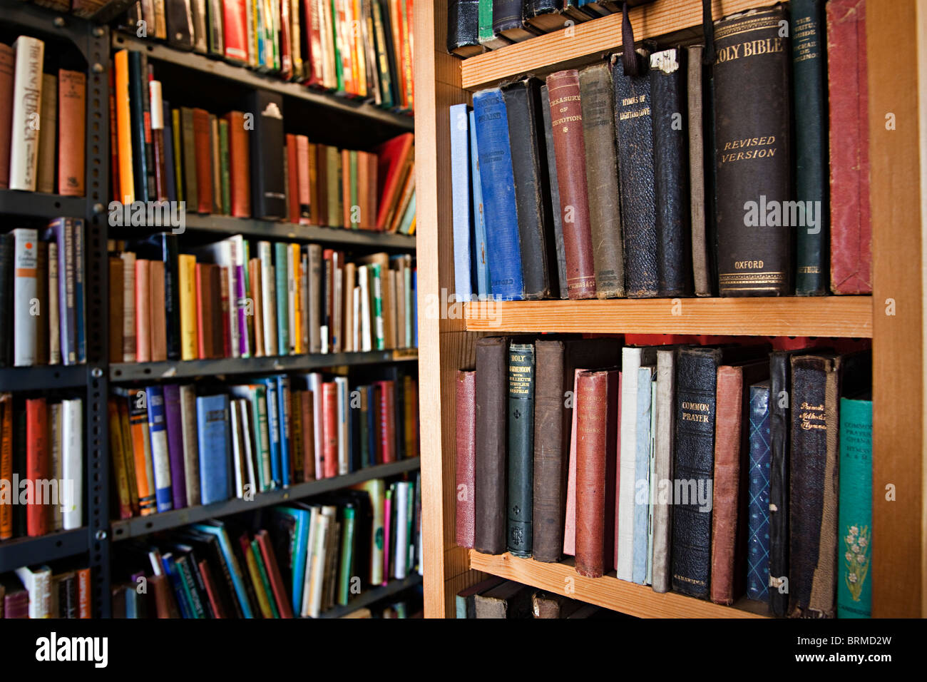 Second hand books on shelves in with religios books in