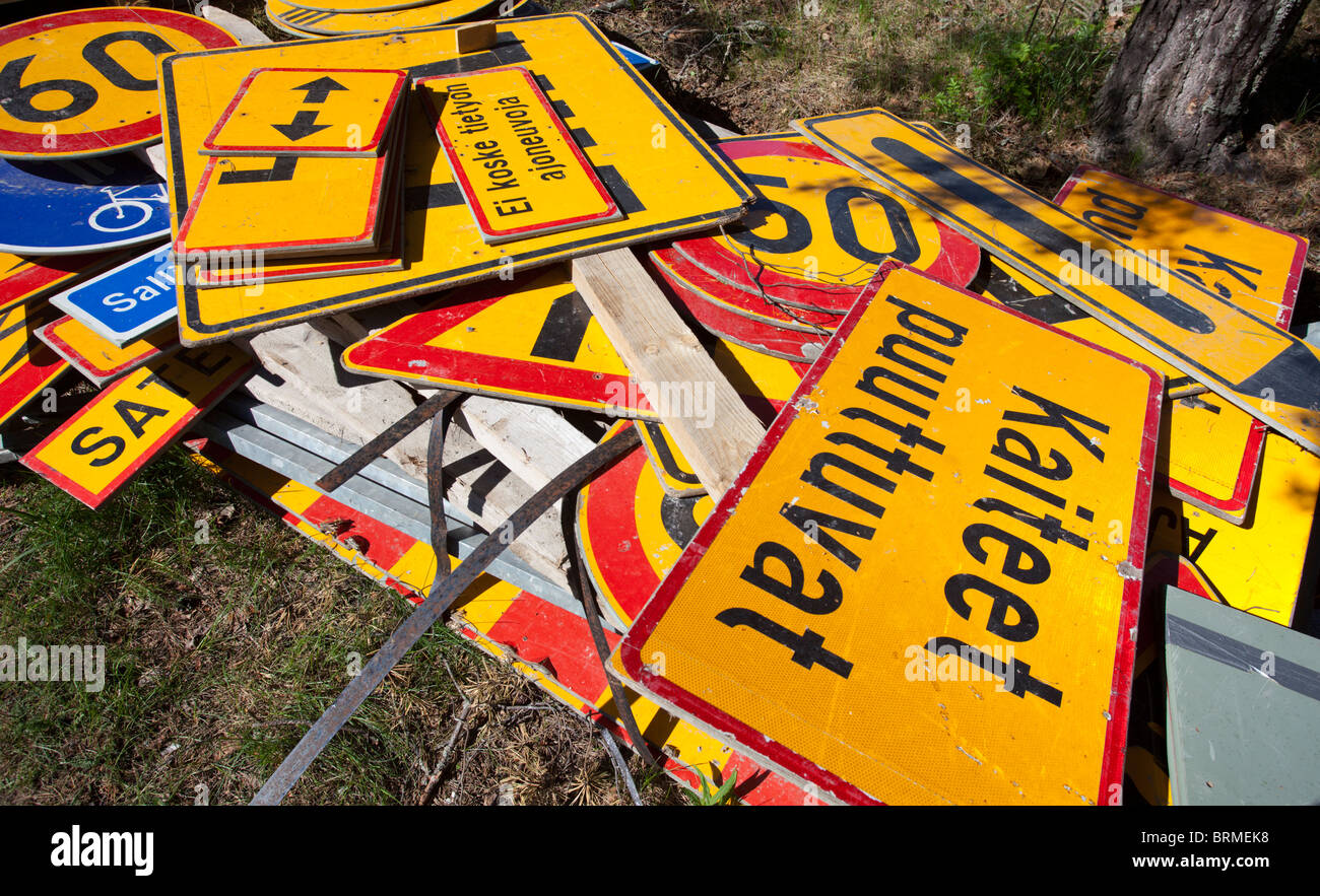 Messy inventory pile of Finnish traffic signs lying on the ground ...