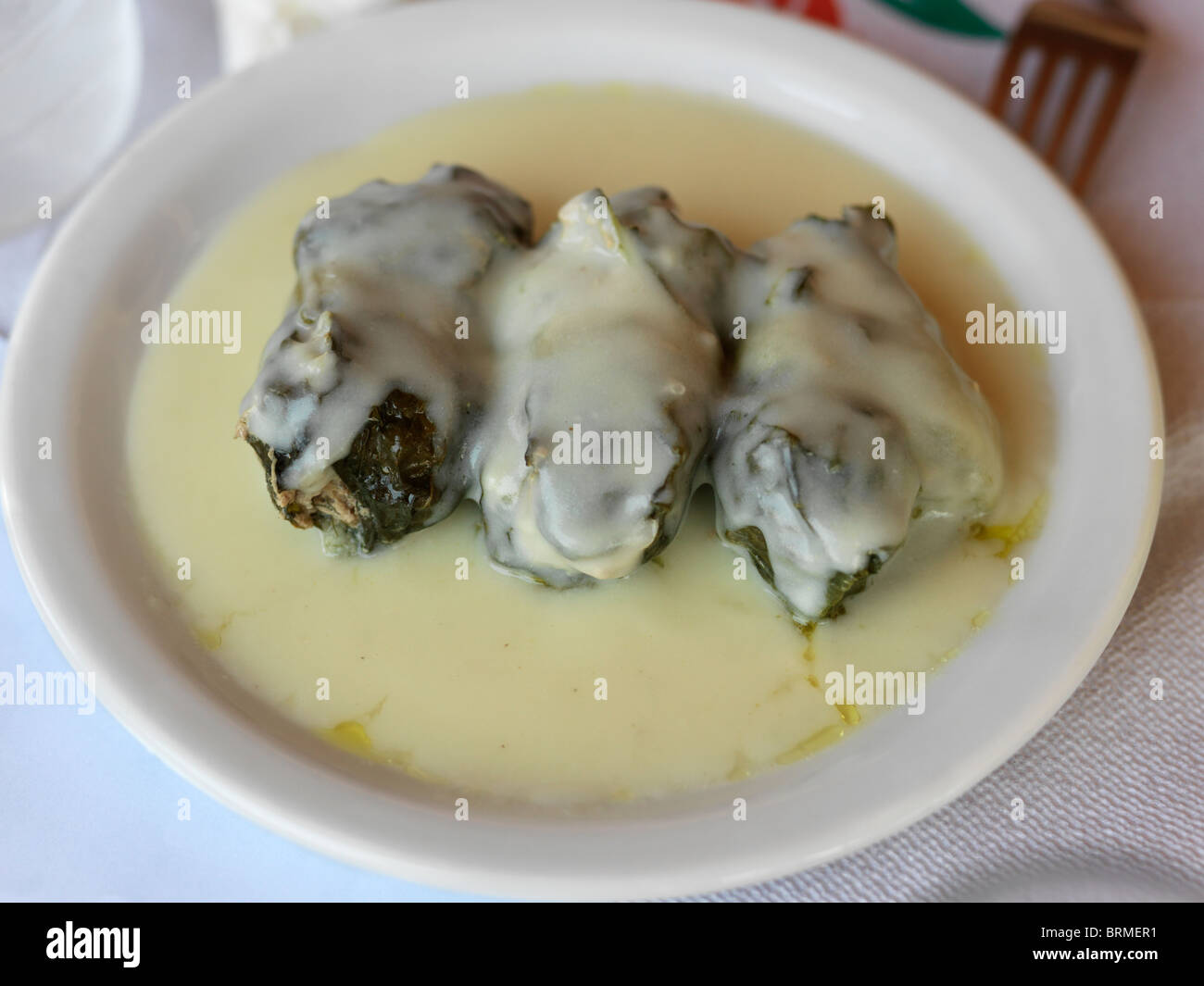 Mykali Samos Greece Plate Of Dolmades Vine Leaves Wrapped Around Rice And Herbs With A Lemon And Egg Sauce Stock Photo