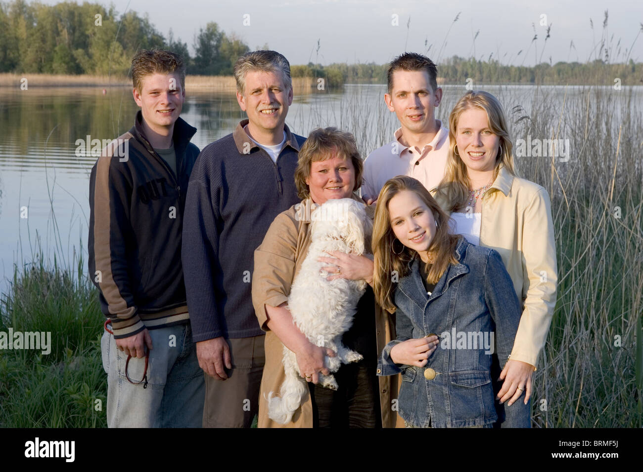 Family unit members and dog Stock Photo